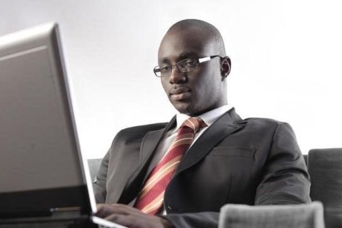 ___3887149___https:______static.pulse.com.gh___webservice___escenic___binary___3887149___2015___6___19___16___black-man-types-on-laptop_t750x550