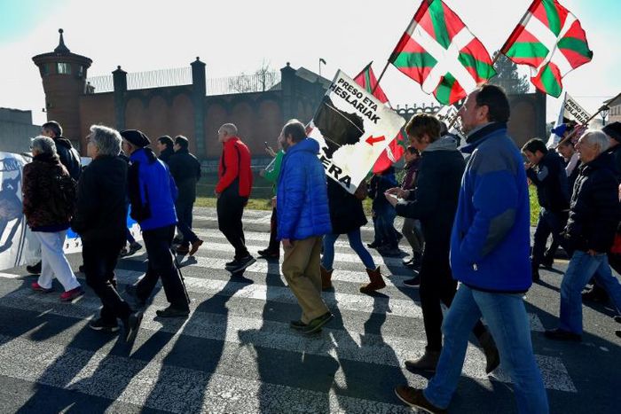 People holding Basque flags demonstrated in December outside Basauri jail near Bilbao for the release of ETA-linked prisoners -- but some relatives of the group's victims strongly oppose detainees being brought closer to home