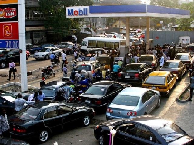 Car owners queuing at a petrol station in Nigeria