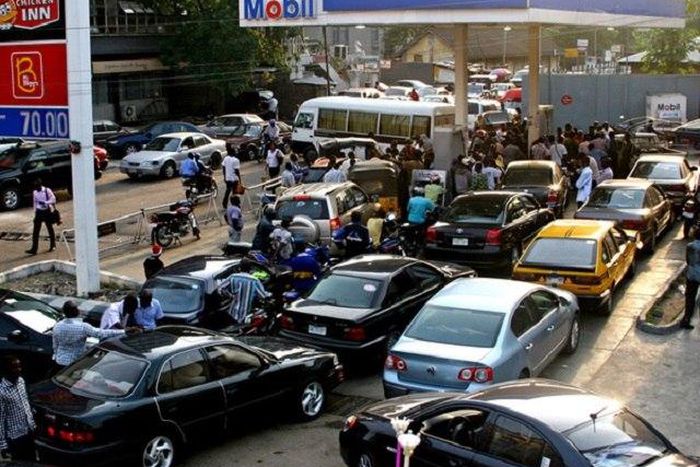 Car owners queuing at a petrol station in Nigeria