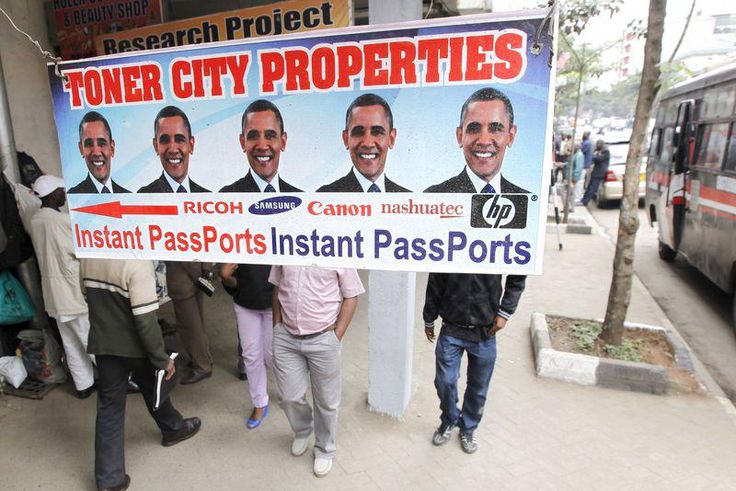 Residents walk past a commercial poster with the portrait photo of the U.S. President Barack Obama ahead of his scheduled State visit in Kenya's capital Nairobi July 23, 2015. REUTERS/Thomas Mukoya