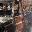 Security officers guard a police car, which was burnt during an attack on a convoy escorting Mandera governor Ali Roba, outside Mandera town, near Kenya's border with Somalia and Ethiopia, March 13, 2015.   REUTERS/Stringer