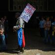 A man holds a placard reading "Die Tyranny / Long Live Freedom" outside the National Assembly building in Caracas on January 5, 2019