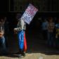 A man holds a placard reading "Die Tyranny / Long Live Freedom" outside the National Assembly building in Caracas on January 5, 2019