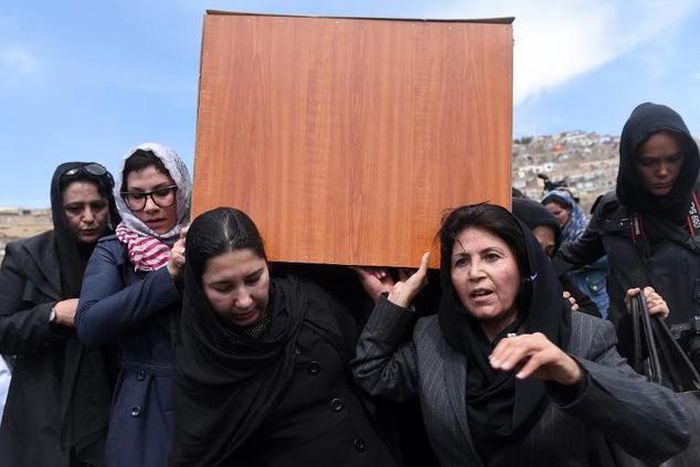 Afghan women carry the coffin of Farkhunda, 27, who was lynched by an angry mob for allegedly burning the Koran, in central Kabul on March 22, 2015