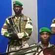 Three soldiers wearing the green beret of the Republican Guard were visible on a video of the speech circulating on social media