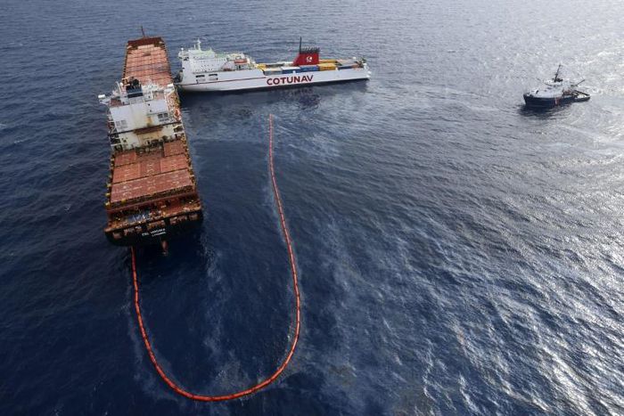 In this file photo taken on October 10, 2018 the French navy ocean tug L'Abeille Flandre (R) approaches two cargo ships - the Tunisian freighter Ulysse (C) and Cyprus-based vessel anchored CLS Virginia (L) - after they collided north of Corsica