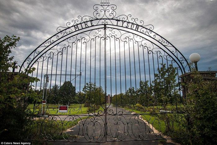 The iron gates at the entrance to the derelict mansion in Southington, Ohio, still bear the name of the former heavyweight champ