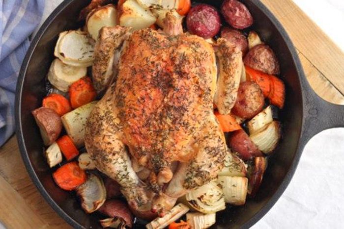 Roasted chicken, seasoned with salt, fresh ground pepper, and thyme, and cooked with root vegetables.