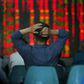 An investor looks at information displayed on an electronic screen at a brokerage house in Shanghai May 12, 2015.   REUTERS/Aly Song