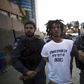 Israeli policemen detain a protestor during an anti-racism protest in Tel Aviv June 3, 2015. REUTERS/Amir Cohen