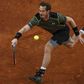 Britain's Andy Murray returns a forehand to Canada's Milos Raonic during their quarterfinal match at the Madrid Open tennis tournament in Madrid, Spain, May 8, 2015. REUTERS/Sergio Perez