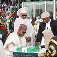 Muhammadu Buhari taking his oath of office on Friday, May 29, in company of his wife and legal luminaries.