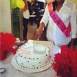 Michelle Ashionye Raccah cutting her baby shower cake