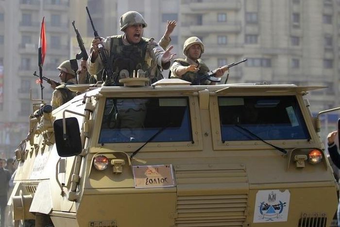 Army soldiers take their positions with their armoured personnel vehicle in the Cairo suburb of Matariya November 28, 2014. REUTERS/Mohamed Abd El Ghany