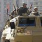 Army soldiers take their positions with their armoured personnel vehicle in the Cairo suburb of Matariya November 28, 2014. REUTERS/Mohamed Abd El Ghany