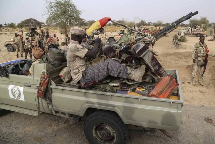 Chadian soldiers drive a pickup truck with anti-aircraft weaponry mounted on it in the recently retaken town of Damasak, Nigeria, March 18, 2015.    REUTERS/Emmanuel Braun
