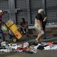 Residents of Caracas now sell and exchange second-hand clothes, shoes and other goods in the streets