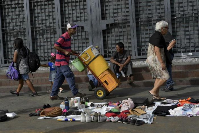 Residents of Caracas now sell and exchange second-hand clothes, shoes and other goods in the streets