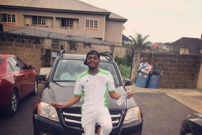 Olamide poses with Alexander Okeke's newly acquired 4matic GLK 350 Benz valued at N10m