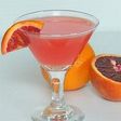 a glass of martini mixed with tangerine