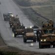 A US military convoy passes the flashpoint Syrian town of Manbij on December 30, 2018, part of a deployment the US-led anti-jihadist coalition says it has now begun withdrawing following a controversial decision by President Donald Trump last month