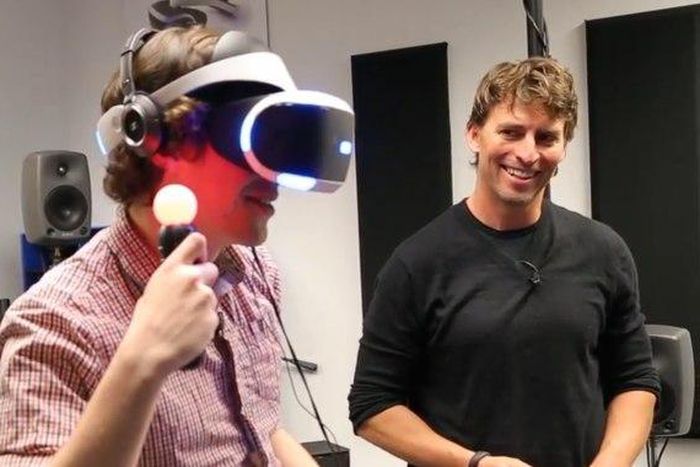 TechCrunch's Kyle Russell reviewing PlayStation's VR headset with PlayStation director Richard Marks.