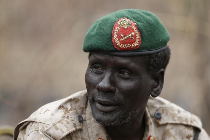 Rebel General Peter Gatdet Yaka talk to his comrades in a rebel-controlled territory in Jonglei State February 1, 2014. REUTERS/Goran Tomasevic