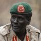 Rebel General Peter Gatdet Yaka talk to his comrades in a rebel-controlled territory in Jonglei State February 1, 2014. REUTERS/Goran Tomasevic