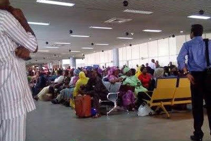 Passengers stranded at the airport on Thursday.