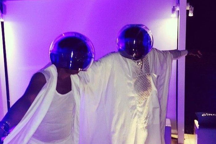 David Tlale and D'Banj adorning Daft Punk helmets on white attires