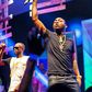 Davido and Danagog performing together at an event