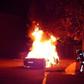 The Ferrari on fire in front of a brothel