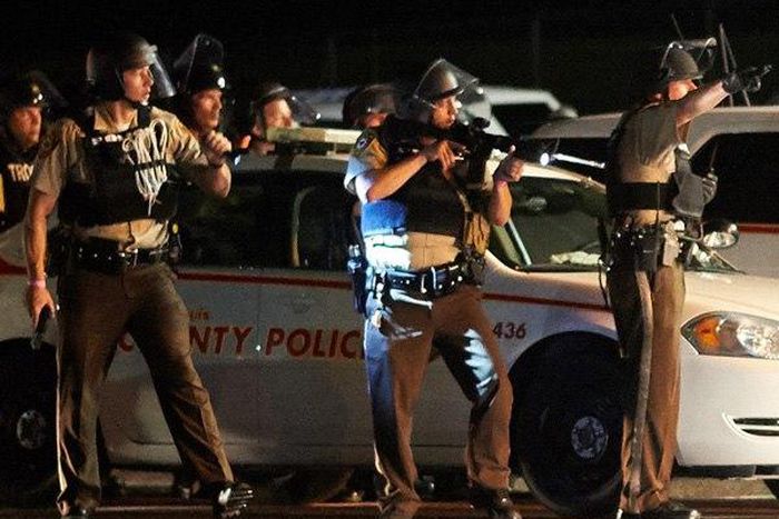 Gunshots heard as Ferguson protests turn violent a year after Brown shooting