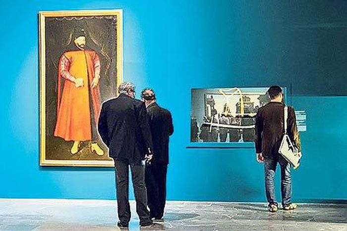 Visitors view paintings and other items on display at the exhibition “Ottomania: The Ottoman Orient in Renaissance Art” on its opening day at the National Museum in Krakow.