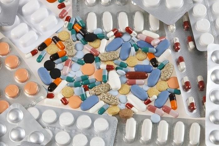 Pharmaceutical tablets and capsules in foil strips are arranged on a table in this picture illustration taken in Ljubljana August 20, 2014.   REUTERS/Srdjan Zivulovic