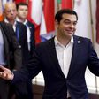 Greek Prime Minister Alexis Tsipras gestures as he leaves an emergency euro zone summit in Brussels, Belgium, July 7, 2015.
