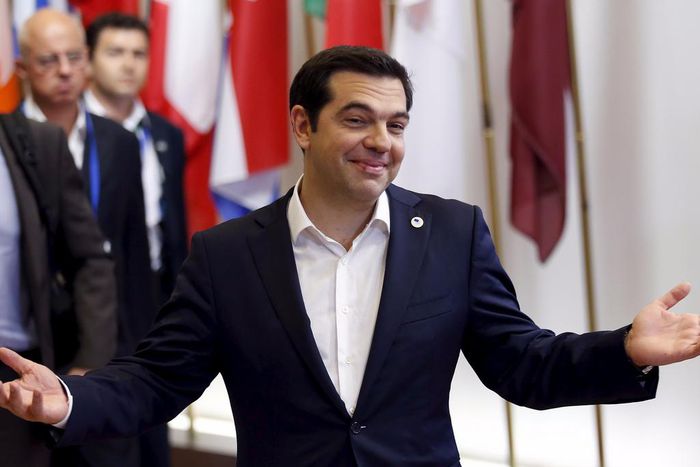 Greek Prime Minister Alexis Tsipras gestures as he leaves an emergency euro zone summit in Brussels, Belgium, July 7, 2015.