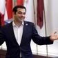 Greek Prime Minister Alexis Tsipras gestures as he leaves an emergency euro zone summit in Brussels, Belgium, July 7, 2015.