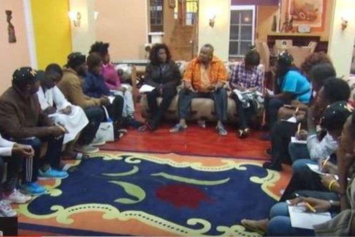 Olisa Adibua with 14 housemates