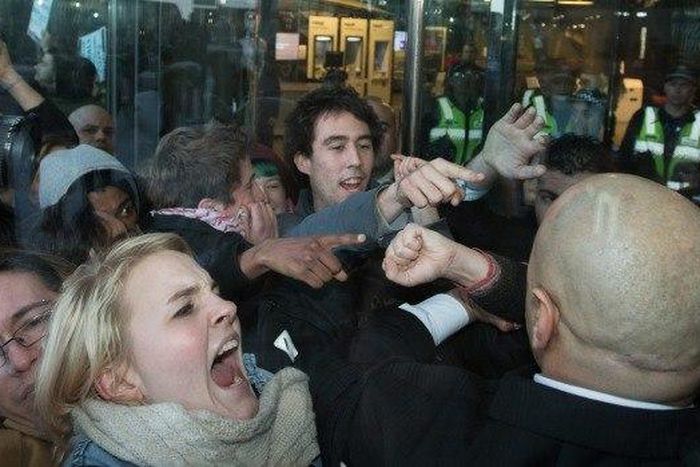 Demonstrators clash with police outside NAB headquarters in Melbourne's Docklands.