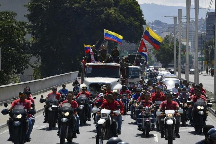 Supporters of Venezuelan President Nicolas Maduro march in his defense on January 7, 2019