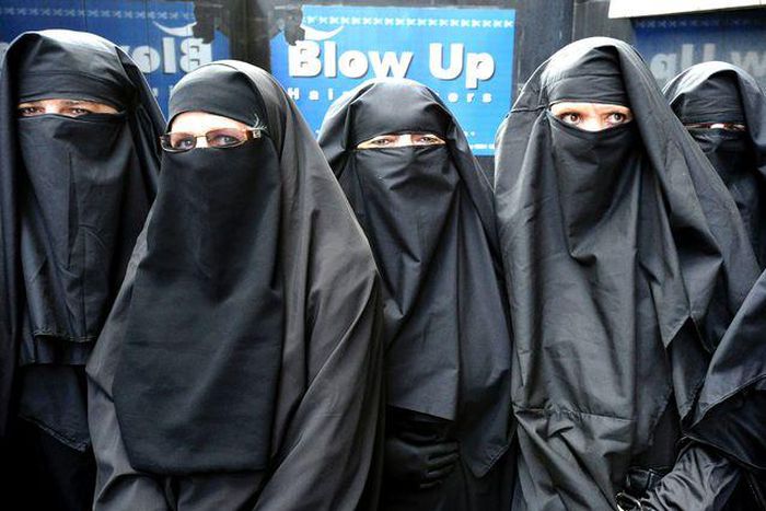 Arab women clad in head-to-toe Burqas, popularly known as Hijab.