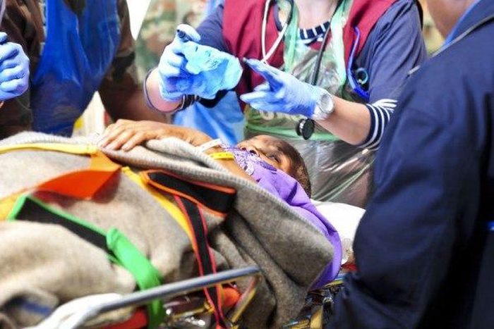 Medical teams attend to one of the 25 survivors who were injured in the building collapse of the Synagogue Church of All Nations in Lagos at Steve Biko hospital in Pretoria on 22 September 2014