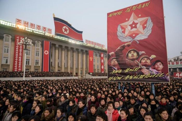 North Koreans, whose country is facing "signficant humanitarian challenges" according to the UN, shout slogans in support of leader Kim Jong Un's New Year's address