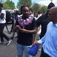 Wale discussing with residents of Baltimore