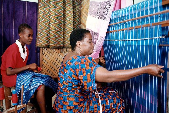 An Akwete weaver with her apprentice