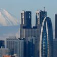 Japan's Mount Fuji behind Tokyo's skyscrapers.