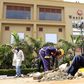 Construction workers dig holes to erect barriers at the reopened Westgate shopping mall, which was closed in the aftermath of an attack by militant gunmen in September 2013 that killed 67 people and injured many more, in capital Nairobi July 14, 2015. ...