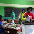 A woman votes during the presidential election in Libreville, Gabon, August 27, 2016.